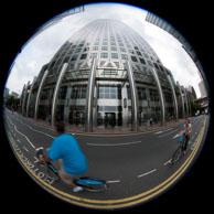 Cyclists passing One Canada Square / Cyclists passing One Canada Square, Canary Wharf